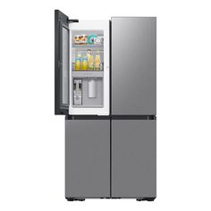 a silver refrigerator freezer sitting inside of it's side door open on a white background