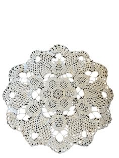 a white doily on a white background