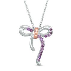 Decorate your party look with this feminine gemstone necklace. Crafted in sterling silver, this darling piece is centered with a sweet looping bow - lined partly with petite bright purple amethyst and finished with a polished 10K rose gold detail. Buffed to a brilliant luster, this 18.0-inch rope chain necklace secures with a spring-ring clasp. Elegant Purple Pendant Birthstone Necklace, Formal Sterling Silver Jewelry With Ribbon, Formal Sterling Silver Ribbon Jewelry, Sterling Silver Birthstone Necklaces For Parties, Pink Bow Jewelry Gift, Feminine Jewelry With Pink Bow As Gift, Fine Jewelry With Bow For Anniversary, Fine Jewelry Anniversary Bow Jewelry, Fine Jewelry Bow For Anniversary