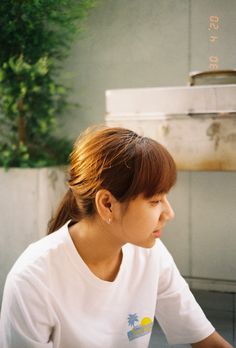 a woman sitting at a table with food in front of her