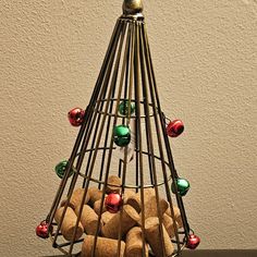 a christmas tree made out of cookies on top of a wooden table next to a wall