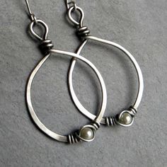 Eco friendly sterling silver (16G) has been hand formed and hammered into hoops. An organic spiral has been wire wrapped around a 4mm cream Swarovski pearl. The hoops have been oxidized and lightly brushed with steel wool and then polished for a soft patina. Ear wires are hand formed from sterling silver. Earrings measure 2.75 inches from top of ear wire to bottom of teardrop. All silver used has come from a recycled source. Thank you for looking! Pam :) Back to this shop-----> http://www.etsy.c Forged Jewelry, Sci Fi Jewelry, Easy Earrings, Silver Wire Earrings, Bijoux Fil Aluminium, Duluth Mn, White Pearl Earring, Wrap Earrings, Earrings Wire