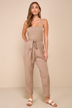 The secret to effortless dressing is having elevated pieces like the Lulus Poised Simplicity Light Brown Backless Overall Slim Leg Jumpsuit to rely on! Lightweight, slightly textured linen-like woven fabric shapes this chic jumpsuit that has wide buttoning adjustable tank straps and an apron-style bodice with an open back. Removable sash belt wraps the waist, atop slim legs with front diagonal pockets that ends at ankle-length hems. Hidden zipper/clasp at back. Fit: This garment fits true to siz Chic Jumpsuit, Casual Formal Dresses, Jumpsuit Chic, Lulu Fashion, Backless Jumpsuit, Casual Wedding Dress, Sash Belt, Slim Leg, Slim Legs