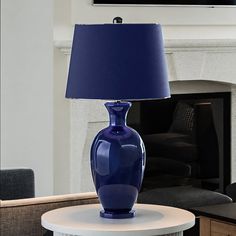 A beautiful UEX7480 Glam Table Lamp with a Navy Blue and Black Nickel Finish from the Genevieve Collection by Urban Ambiance on a table in a living room. Glam Table Lamps, Glam Table, Gourd Lamp, Table Console, Contemporary Table Lamps, Habitat For Humanity, Black Lamps, Silver Foil, Blue Tones