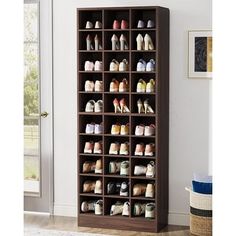 the shoe rack has many pairs of shoes on it