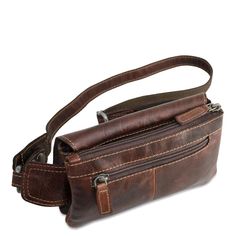 FREE GROUND SHIPPING & FREE MONOGRAMMING! HAND-STAINED BUFFALO LEATHER Travel around town with your hands-free and your must-have items kept safely inside this stylish belt bag. The Voyager Waist Bag is made from vegetable re-tanned buffalo leather and features a small profile and a rustic design with multiple storage pockets with a single adjustable strap that makes it comfortable to wear. This bag has a top zippered main compartment with a front magnetic flap-over pocket, back zippered poc Cross Shoulder Bags, Leather Waist Bag, Leather Fanny Pack, Leather Belt Bag, Pocket Top, Must Have Items, Adjustable Belt, Buffalo Leather, Leather Travel