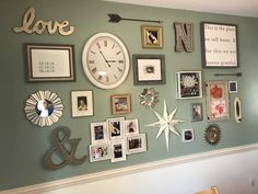 the wall is covered with many pictures and clocks