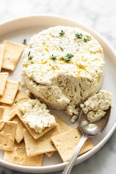 a plate with crackers and cheese on it