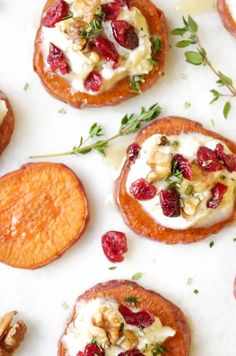 sweet potato rounds with cranberry sauce and walnuts on a white tablecloth