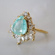 Read about our payment plans before proceeding.Prized for its neon blue color, the Paraiba Tourmaline is a collectors gem. The Paraiba Tourmaline Opulence Diamond Ring is sure to make your heart skip a beat. Featuring a certified 2.13ct natural pear Paraiba Tourmaline. It's truly a one-of-a-kind gem. Handcrafted in your choice of 14K yellow gold, rose gold, or white gold. All order comes in a Tippy Taste ring box. This ring is handmade and designed in NYC. 14K or 18K solid gold 1.6mm ring band N Paraiba Tourmaline Ring, Fine Jewlery, Ring Upgrade, Tourmaline Engagement Ring, Fall Rings, Paraiba Tourmaline, Pear Cut Diamond, Blue Tourmaline, Dream Engagement