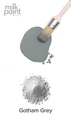 a paint brush and some white powder on a white background with the words milk paint