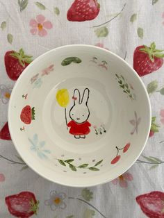 a bowl with an image of a bunny holding a balloon