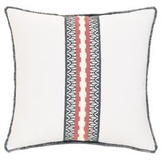 a white pillow with red and blue stripes on the front, sitting against a white background