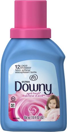 downy hand soap with pink flowers on the front and blue bottle in the back