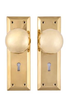 an image of two golden door knobs