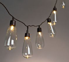 some light bulbs are hanging from a string