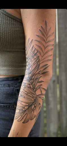 a woman with a tattoo on her arm