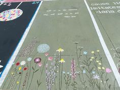 the sidewalk has flowers painted on it