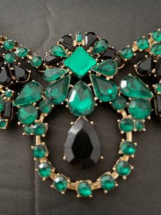 Vintage French Statement Necklace, Emerald Green and Jet Black. A wow of a vintage French statement necklace, dazzling for evenings on the town. Hinged frame with individually set composite rhinestones in clear emerald green and faceted black. Center medallion.  So glamorous, found in Paris. Adjustable 19-22 inches. Perfect for weddings, formal events, proms, quinceanaras.  No missing stones. Shipped with care. Necklace Emerald, Hinged Frame, Vintage French, Jet Black, French Vintage, Emerald Green, Formal Event, Crystal Necklace, Statement Necklace