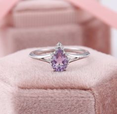 Pear Shaped Amethyst Ring, Teardrop Amethyst Ring, White Gold Purple Engagement Rings, February Birthstone Ring, Lavender Promise Ring ✧･ﾟ: *✧･ﾟ:* Welcome to Charles Davin Jewelry*:･ﾟ･ﾟ✧ Moissanite - a gemstone known to bring in luck in someone's life, the user can give off a look of elegance. You can give your special someone luck whilst showing your love to them. ✶Material: 10K/ 14K/ 18K ✶Main Stone: Natural Amethyst; 5*7mm ✶Side Stone: Moissanite; Total: 0.07ct ✶Color: D Colorless ✶Clarity: V Cheap Purple Promise Ring, Luxury Lavender Promise Ring, Promise Rings For Her Purple, Luxury Elegant Pear-shaped Amethyst Ring, Luxury Lavender Amethyst Promise Ring, Fine Jewelry Teardrop Purple Ring, Fine Jewelry Purple Teardrop Ring, Purple Teardrop Fine Jewelry Ring, Teardrop Amethyst Ring For Anniversary