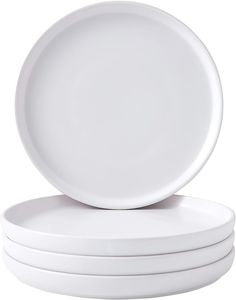 three white plates stacked on top of each other