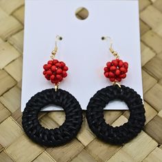 Black Rattan Dangle Earrings with Red Beads - Bold and Elegant! Enhance your style with our exquisite Black Rattan Dangle Earrings featuring Red Beads. These earrings combine the sophisticated allure of black rattan with the vibrant pop of red beads, creating a striking and unique accessory. Perfect for any occasion, these earrings add a touch of natural elegance and bold color to your ensemble, whether you're dressing up for a special event or enhancing your everyday look. Why You'll Love Our B Black Dangle Jewelry For Beach, Woven Red Jewelry For Summer, Beach Jewelry With Black Dangling Beads, Black Beaded Earrings For The Beach, Black Dangling Beads Jewelry For Beach, Black Beaded Earrings With Dangling Beads For Beach, Black Beaded Earrings For Beach, Black Beach Jewelry With Dangling Beads, Red Round Earrings For Beach