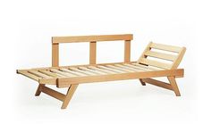 a wooden bed frame sitting on top of a white floor