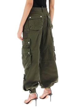 Dsquared2 cargo pants crafted in stretch cotton drill with multi-pocket design. They feature front logoed button-fly closure and belt loops. Enriched by distressed detailing and rubberized logo lettering on the leg. Loose fit with wide leg and buttoned strap at the hem. The model is 177 cm tall and wears size IT 38. Wide Leg Cargo Pants, Womens Pants Design, Cargo Pants Women, Cargo Trousers, Denim Pant, Denim Top, Lanvin, Pocket Design, Valentino Garavani