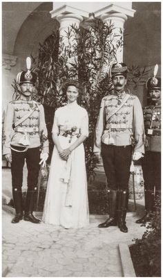 an old black and white photo of people in uniforms