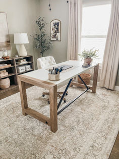 a living room with a couch, coffee table and bookshelf