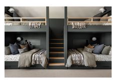 two bunk beds sitting next to each other on top of a carpeted floor in a bedroom