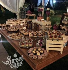 a table topped with lots of pies and cupcakes