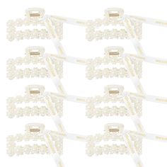 six pairs of white hair clips with pearls on each side and gold metal clips in the middle