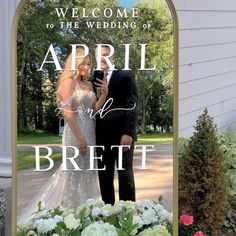 a sign that says, welcome to the wedding of april and breit on it