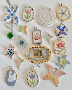 a collection of glass and metal items on a white surface, including an ornament