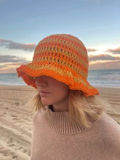 This crochet bucket hat is made by hand! The material is light and soft so perfect for a day at the beach, a fashion piece and even to keep you warm. Spring Beach Cloche Hat One Size, Spring Beach Knitted Cloche Hat, Spring Knitted Cloche Hat For Beach, Cotton Sun Hat, Casual Beach Cloche Hat, Beach Crochet Hat Hand Knitted, Hand-knitted Crochet Hat For Beach, Trendy Hand Knitted Beach Hats, Trendy Beach Hats Hand Knitted