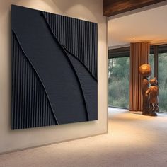 a large painting hanging on the wall in a living room next to a doorway with glass doors