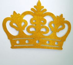 a gold crown cut out on a white background