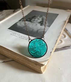 New Teal Glass Swirl Necklace Stained Glass Jewelry Holiday - Etsy Vintage Glass Necklace Nickel Free, Vintage Glass Nickel-free Necklace, Vintage Nickel-free Glass Necklace, Patina Round Pendant Necklace For Gift, Patina Round Pendant Necklaces For Gift, Round Pendant Necklace With Patina For Gift, Antique Round Glass Necklaces, Antique Round Glass Necklace, Vintage Glass Round Pendant Jewelry