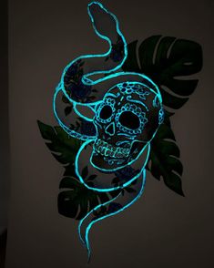 a skull and snake glow in the dark