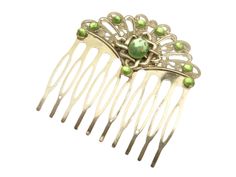 This elegant hair comb is a beautiful accessory, for example for the Irish bride. The hair accessory is made of silver-colored metal. At the top there is a filigree ornament in the shape of a fan. In the middle there is an ornament with Celtic knots and a faceted gemstone in peridot green. The hair comb is also decorated with other high-quality rhinestones, also in peridot green. The hair comb measures 6 L x 5.7 W cm. Irish Bride, Ireland Style, Ireland Fashion, Elegant Hair, Celtic Knots, Bride Hair, Peridot Green, Bride Hair Accessories, Hair Accessories Gift