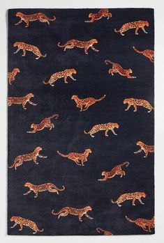 a black rug with leopards on it