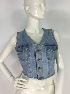 "1990s bongo 100% cotton Jean crop top, size 7, made in USA  mannequin measures 5ft 8\", bust 34\", waist 25\", hip 33\" Measurements:  bust 16\"/length 15\" Please note that vintage clothing sizes can vary greatly.  The Measurements provided are taken with garment lying flat.  I suggest taking a similar garment from your wardrobe and measure it while lying flat.  This way you can compare measurements.   Please note buyer is responsible for any duties, taxes or customs clearance fees imposed by their country. Be sure to check in often as new gems are added daily.. **all sales are final." Jean Crop Top, Top Jean, Crop Top With Jeans, Denim Crop Top, 90s Denim, Jean Top, Customs Clearance, Vintage Jeans, Denim Vest