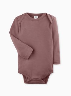 Buttery soft and versatile, our organic long sleeve bodysuit is an essential piece for any growing baby. Made of 100% organic cotton Interlock fabric Nickel-free snaps Water-based dyes ensuring long-lasting color vibrancy and durability Sustainably sourced and ethically produced Naturally hypoallergenic Organic Cotton Long Sleeve Onesie For Spring, Fitted Organic Cotton Long Sleeve Onesie, Fitted Long Sleeve Organic Cotton Onesie, Long Sleeve Solid Cotton Bodysuit, Solid Cotton Long Sleeve Bodysuit, Solid Long Sleeve Cotton Bodysuit, Basic Long Sleeve Bodysuit For Spring, Fall Cotton Long Sleeve Bodysuit, Cotton Long Sleeve Onesie For Fall