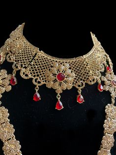 This is the perfect set to give yourself a royal look for your next special occasion! It comes as a full choker, long necklace, passa, earrings and tikka and can be worn separately for a lighter look! 3 Gorgeous colors to pick from ! Red Hand Set Bridal Sets For Party, Red Hand-set Bridal Sets For Party, Elegant Red Sets With Intricate Design, Bollywood Style Intricate Jewelry Sets For Party, Traditional Ruby Jewelry Set For Party, Red Bollywood Jewelry Sets For Party, Red Tikka With Intricate Design For Festive Occasions, Ceremonial Red Bridal Sets With Stone Work, Red Bridal Sets For Festive Party