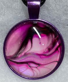 This beautiful Pink Abstract Acrylic Necklace is handmade by me. I use Acrylic Paints and Glass. I use high quality acrylic paints and materials. Artistic Pink Resin Jewelry, Artistic Resin Pendant Necklace, Artistic Pink Necklace For Gift, Artistic Hand Painted Purple Jewelry, Artistic Hand Painted Round Necklace, Handmade Purple Resin Necklace, Artsy Purple Jewelry For Gifts, Artistic Resin Necklaces With Round Pendant, Artistic Resin Necklace With Round Pendant