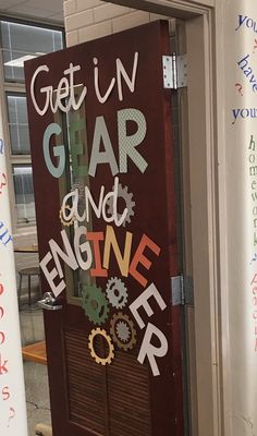 a door decorated with words and gears