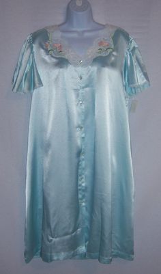 "Vintage Eve Stillman light blue satin lace embroidered nightgown peignoir or gown. Deadstock. Never worn. Original tags still attached. Women's size LARGE. 100% polyester. Measurements: bust-50\", length-39\", waist-56\", hips-60\". Button front. Lace trim on neckline. Lovely!" Elegant Blue Sleepwear For Sleepover, Blue Short Sleeve Dress For Night, Blue Satin Nightgown For Night, Light Blue Sleepwear For Wedding Night In Spring, Blue Satin Nightgown, Blue Satin Nightgown For Wedding Night, Fitted Light Blue Sleepwear For Night, Blue Satin Nightgown For Bedtime, Light Blue Short Sleeve Sleep Dress