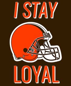 the cleveland browns logo on a brown and white striped towel with an orange football helmet