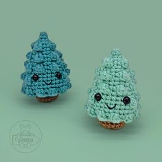 two small crocheted trees sitting next to each other